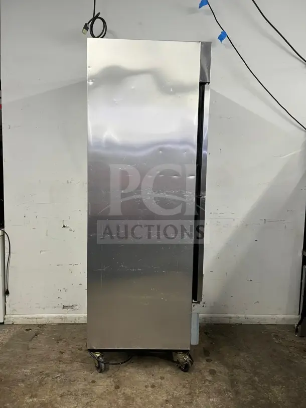 TRUE T-23-2 reach-in refrigerator, 27", two left-hinge solid doors, stainless steel, visible wear, 115V.