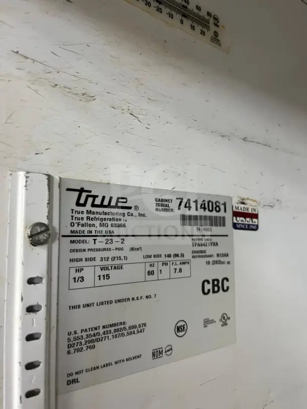 TRUE T-23-2 refrigerator label showing model, voltage, design pressures, and serial number. Made in USA.