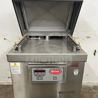 Berkel vacuum packaging machine in stainless steel, model "vacuum machine," very good condition, control panel visible.