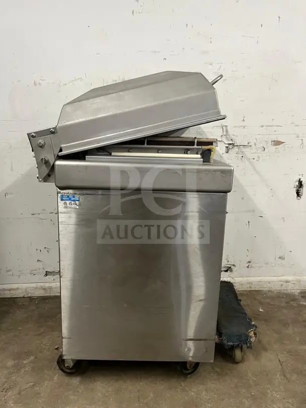 Berkel vacuum packaging machine, stainless steel, very good condition, model label visible, industrial design.