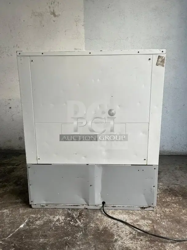 Grab & Go open top display cooler in steel/white, tested and working, visible power cord, some wear on exterior.
