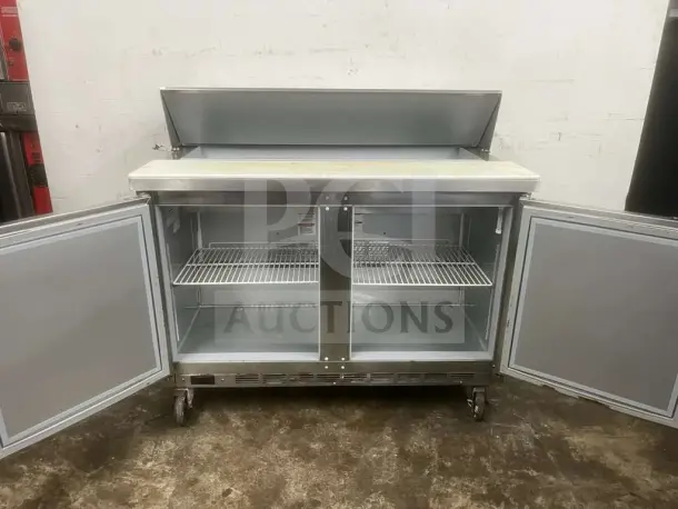 Beverage-Air 48" 2 Door Sandwich Prep Table, stainless steel, open doors, wire shelves, on wheels, good condition.
