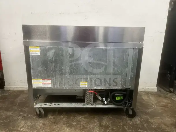 Beverage-Air 48" 2 Door Sandwich Prep Table, visible rear, R290 refrigerant. Use marks, good condition, model PREP TABLE.