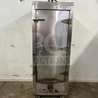 Universal Smoker 78" stainless steel oven, model SMOKER, galvanized interior, 3 burners, visible wear, on wheels.