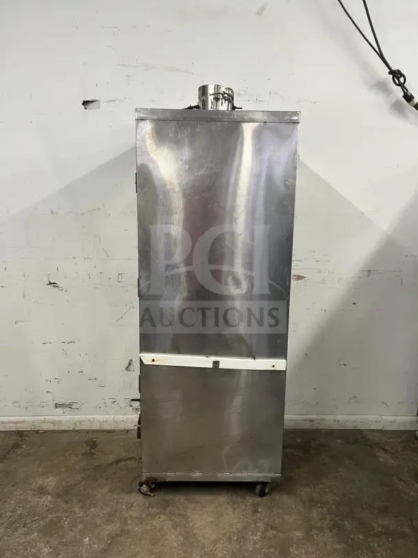 UNIVERSAL Smoker Stainless Steel Oven, Model SMOKER, 78", 3 Burners, galvanized interior, visible wear, on wheels.
