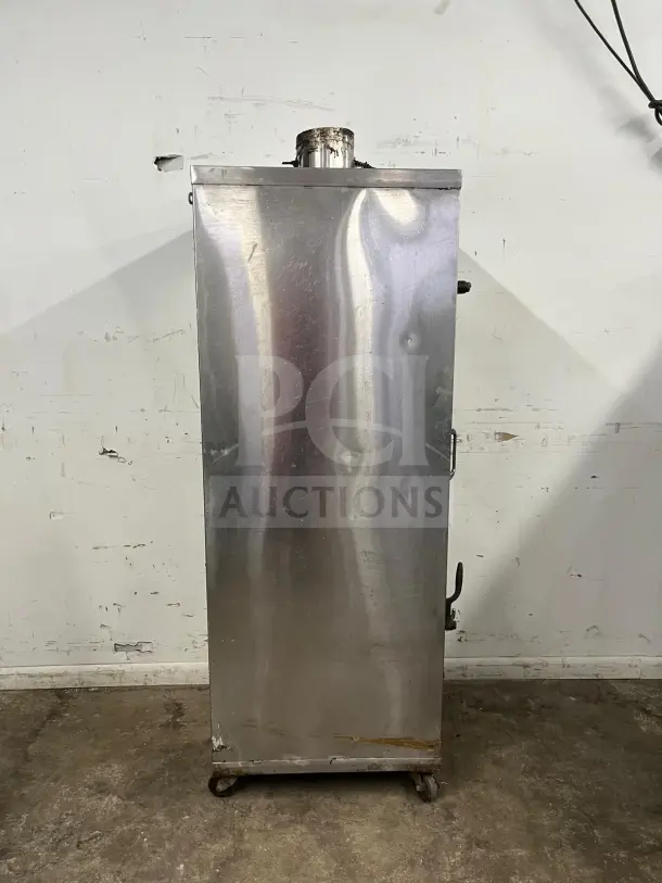 UNIVERSAL SMOKER stainless steel oven, 3 burners, 78", galvanized interior, visible wear, on caster wheels.