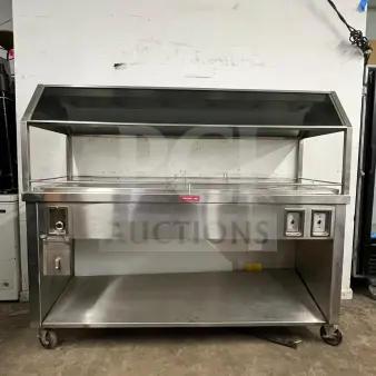 Gaylord stainless steel hot food steam buffet table, model BUFFET TABLE, features durable construction, wheels, and caution hot label.