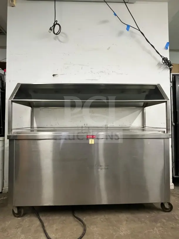 Stainless steel Gaylord hot food steam buffet table, model BUFFET TABLE, on casters. Caution label visible. Good condition.