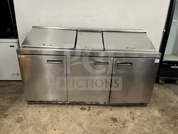 72" stainless steel sandwich/salad prep table with refrigerated base, model preptable. Features mega top, good condition.