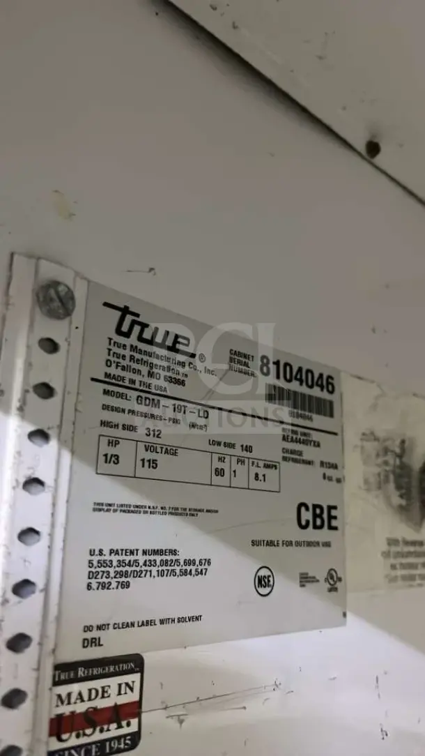 True GDM-26 glass door merchandiser refrigerator label with model, voltage, and manufacturing details. Made in USA.