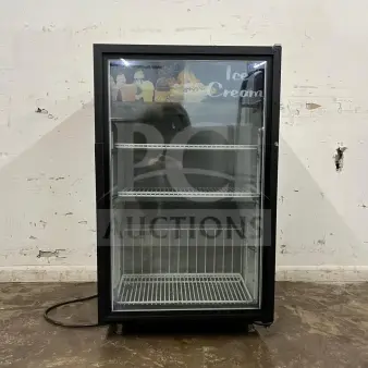 White countertop display ice cream freezer with glass door, excellent condition, shelving visible, and "Ice Cream" label on top.
