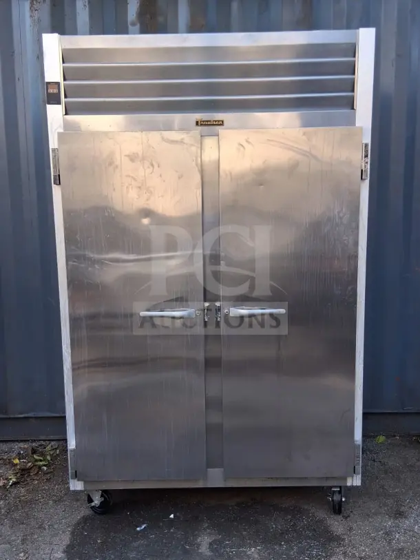 Traulsen G20010 52" G Series solid door reach-in refrigerator with left/right hinged stainless steel doors. Slight wear visible.