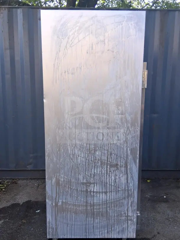 Traulsen G20010 52" G Series solid door refrigerator with visible smudges and wear, left/right hinged doors.