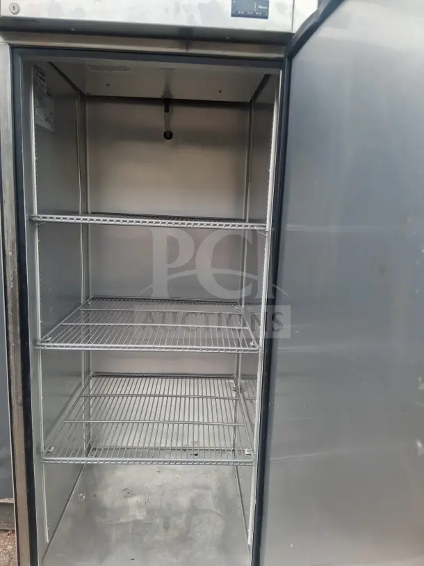 True T-23-HC 27" solid door reach-in refrigerator, stainless steel, three wire shelves, visible control panel, good condition.