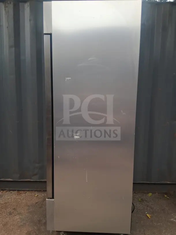 True T-23-HC 27" solid door reach-in refrigerator, used condition with visible scratches, stainless steel exterior.