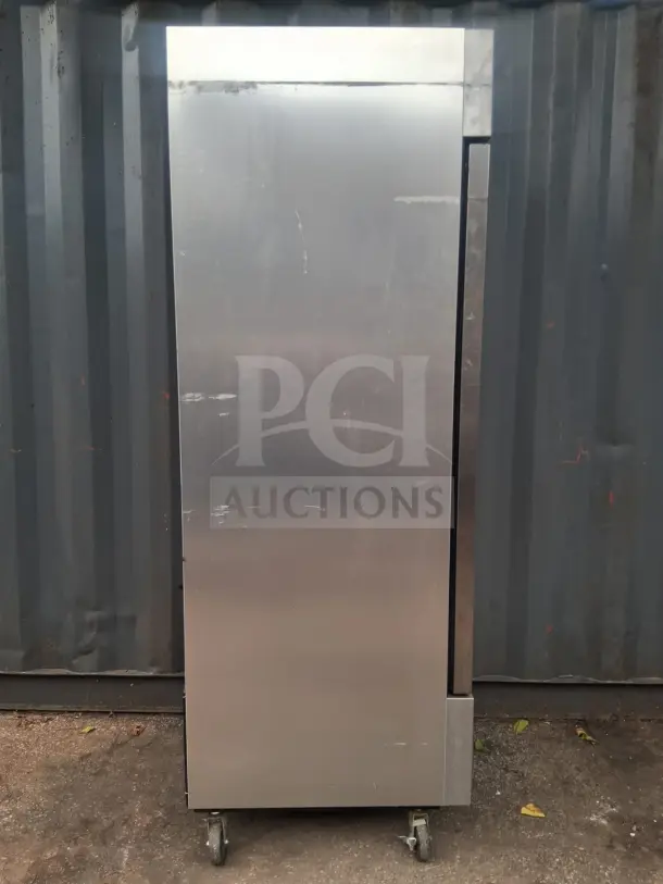 True T-23-HC 27" solid door reach-in refrigerator in used condition, featuring stainless steel exterior and casters for mobility.