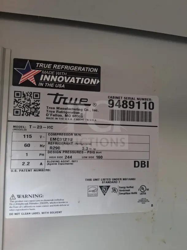 Label on True T-23-HC Refrigerator showing model details, serial number 9489110, and specifications for compressor and refrigerant.
