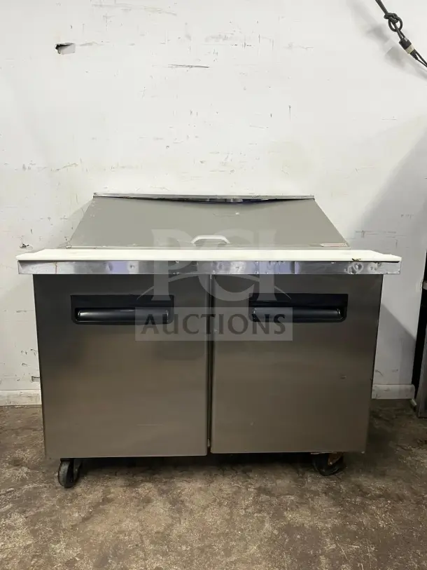 Blue Air BLMT48-HC 48" refrigerated sandwich prep table, two swing doors, stainless steel, 13.1 Cu. Ft., used condition.