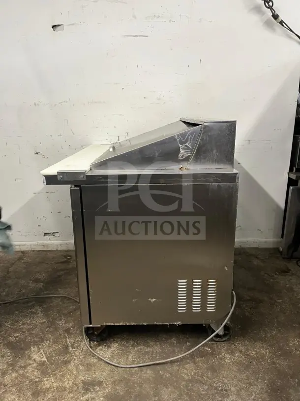 Blue Air BLMT48-HC 48" refrigerated sandwich prep table, two swing doors, used condition, visible scuffs and wear.