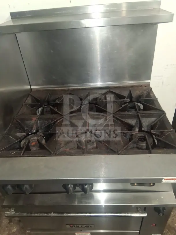 Vulcan 36C-6BN Endurance natural gas range, stainless steel, six burners, used condition, visible Vulcan logo.