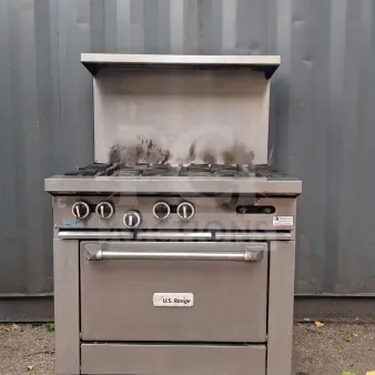 U.S. Range 36" natural gas 6-burner range with standard oven, used condition, visible wear on surface, model label intact.