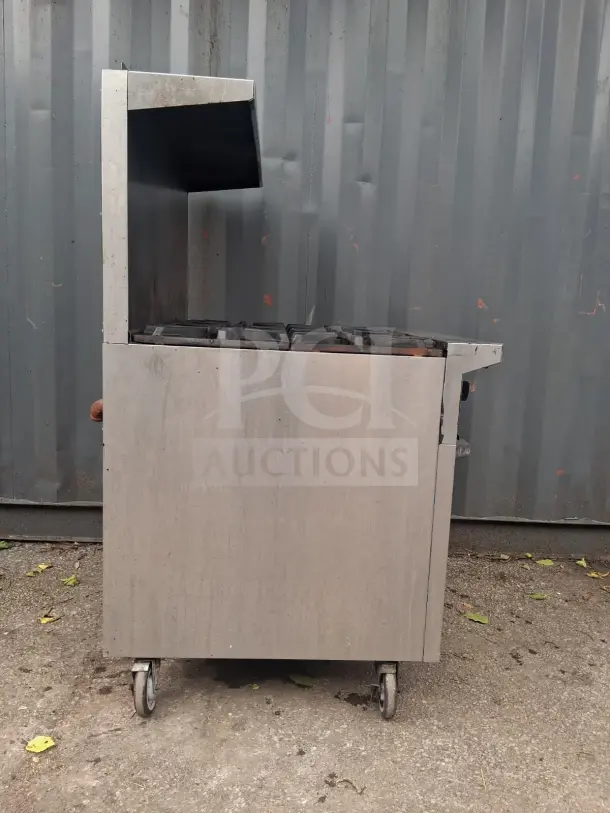 U.S. Range natural gas 6 burner 36" range with standard oven, stainless steel, on wheels, good condition.