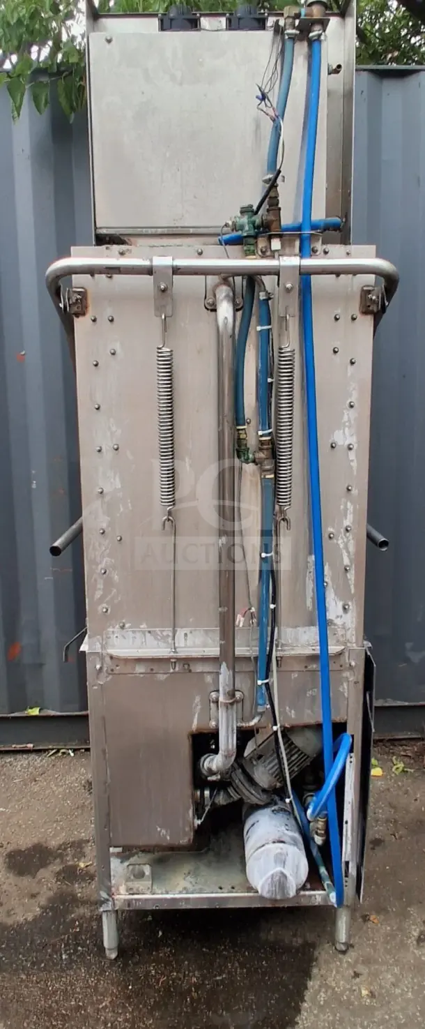 Champion DH5000T door-type high-temp tall hood dishwasher. Visible wear, functional piping, and external motor components.