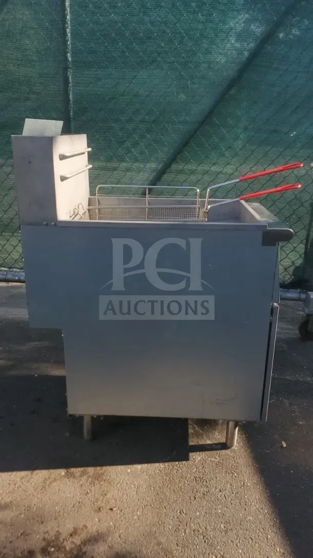 Rocket Cooking 40 lb Capacity Commercial Gas Floor Fryer; metal exterior, dual baskets, moderate wear.