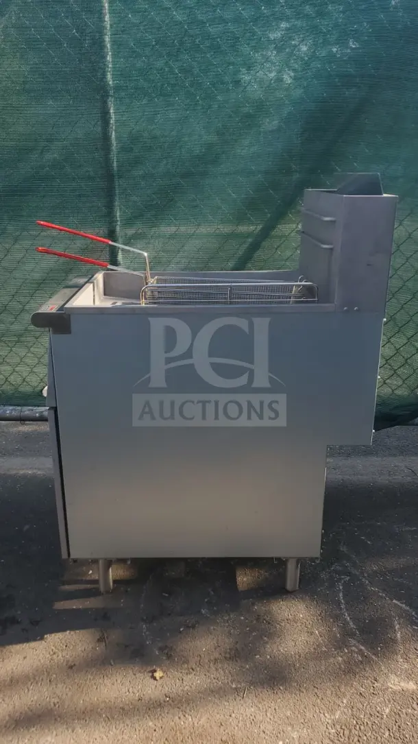 Rocket Cooking 40 lb Capacity Commercial Gas Floor Fryer, stainless steel, side view, clean condition, with fryer basket.