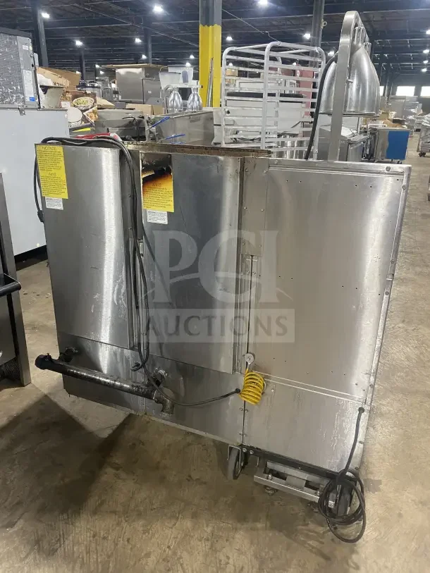 Keating 14TSSI stainless steel dual instant recovery fryer, natural gas, heating element, on casters, with back splash.