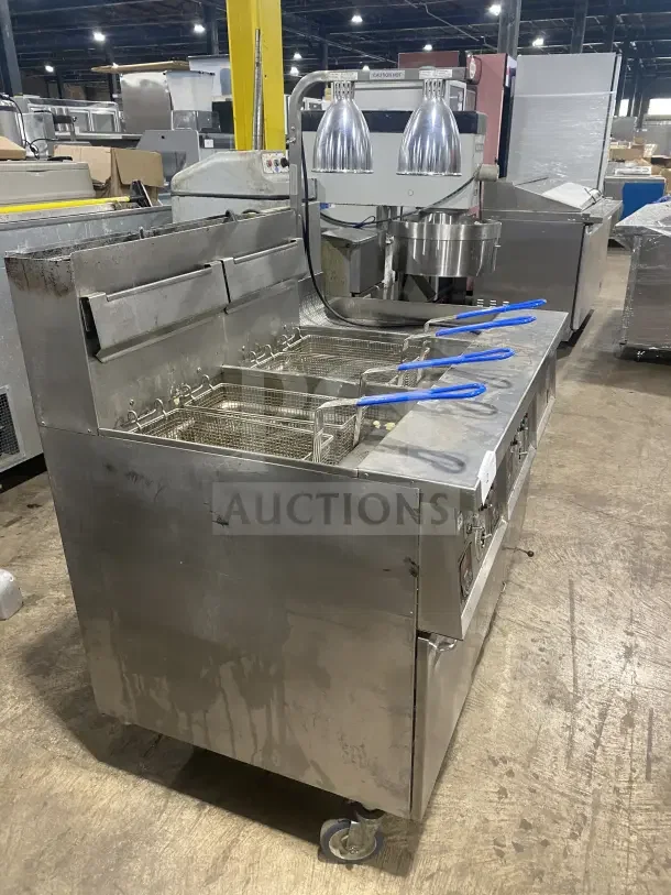 Keating 14TSSI stainless steel dual instant recovery fryer, natural gas, with heating element, backsplash; on casters.