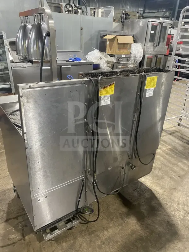 Keating 14TSSI stainless steel dual fryer with back splash, natural gas, 120V 4-phase, on casters, fair condition.