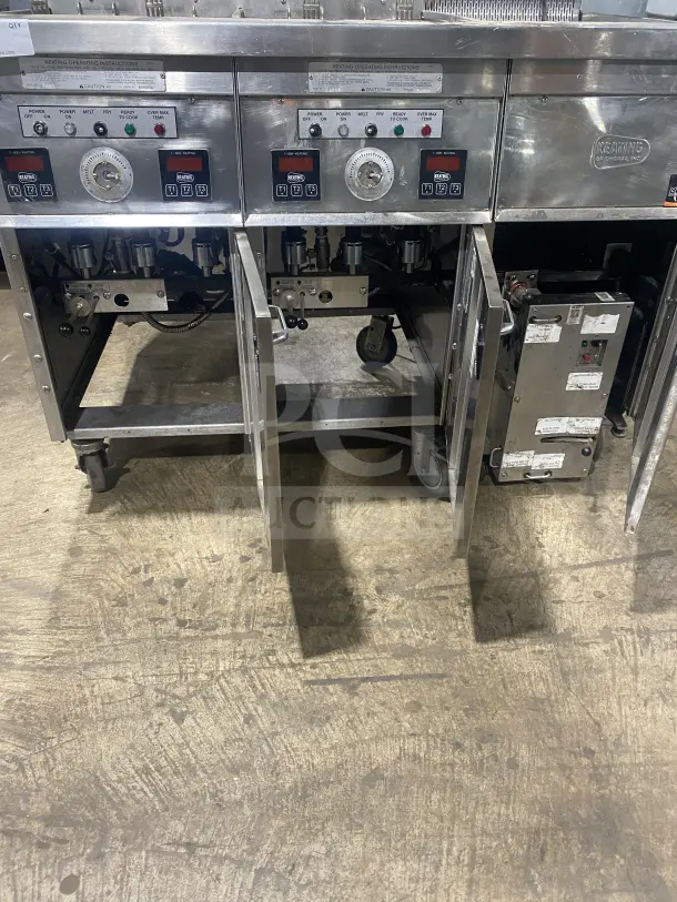 Keating 14TSSI stainless steel natural gas dual fryer with heating element, back splash, on casters, Model: 14TSSI, SN: FG45764.