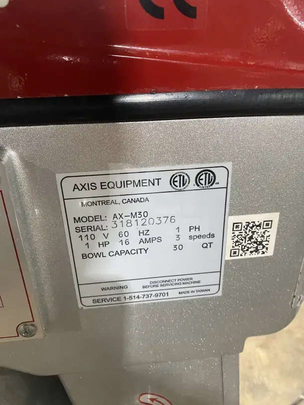 Axis AX-M30 commercial mixer label, showing model, serial number 318120376, capacity 30 qt, 110V, stainless steel.