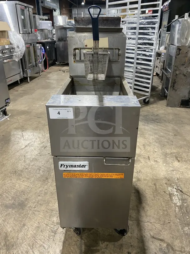 Frymaster commercial stainless steel gas fryer with backsplash, basket hanger, and fry basket. On casters, used condition.