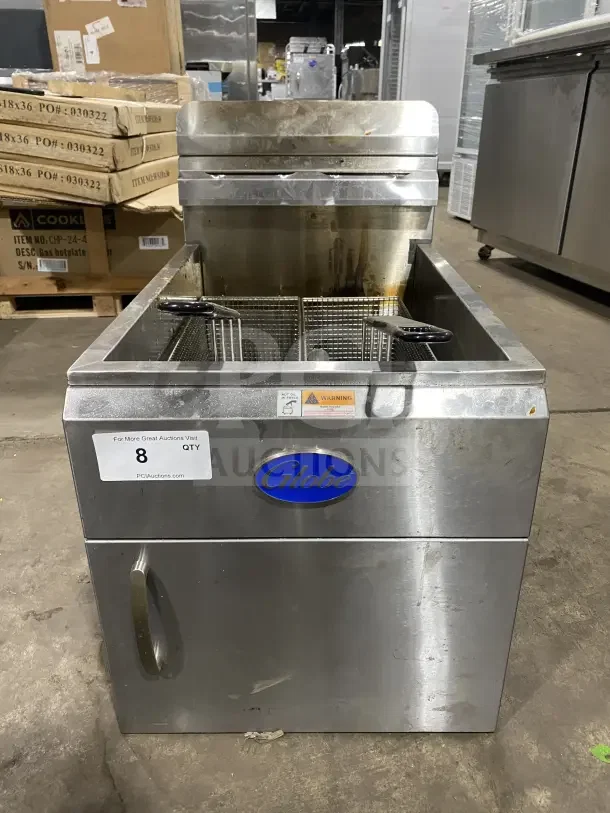 Commercial countertop deep fat fryer by Globe, model GF30G, stainless steel, natural gas powered, with fry baskets, back splash, and basket hanger.