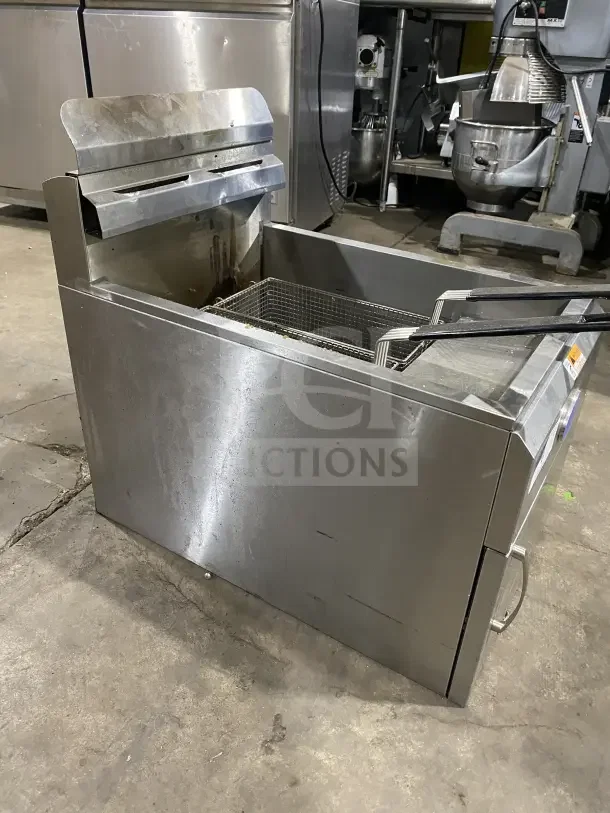 Commercial stainless steel natural gas countertop deep fat fryer, Globe GF30G model, with fryer baskets, backsplash, minor wear.