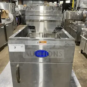 Globe GF30G deep fat fryer, stainless steel, natural gas, late model, with backsplash, basket hanger, and fry baskets.