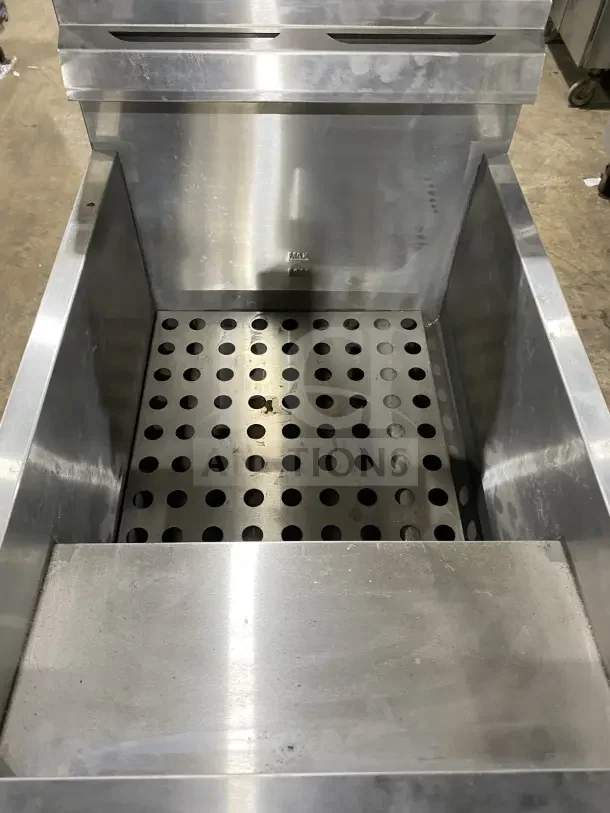 Globe GF30G stainless steel countertop deep fat fryer, natural gas, with backsplash, basket hanger, and fry baskets included.