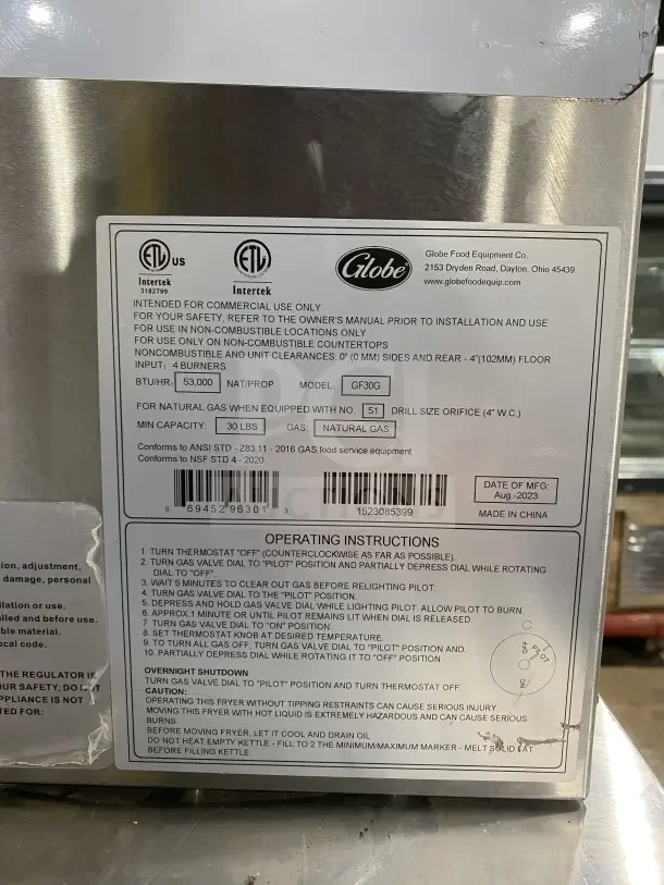Globe GF30G stainless steel natural gas countertop fryer with backsplash, basket hanger, fry baskets. Serial: 1523085399.