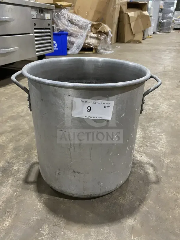 Commercial heavy-duty aluminum stock pot with handles; used condition. Capacity label shows quantity 9.