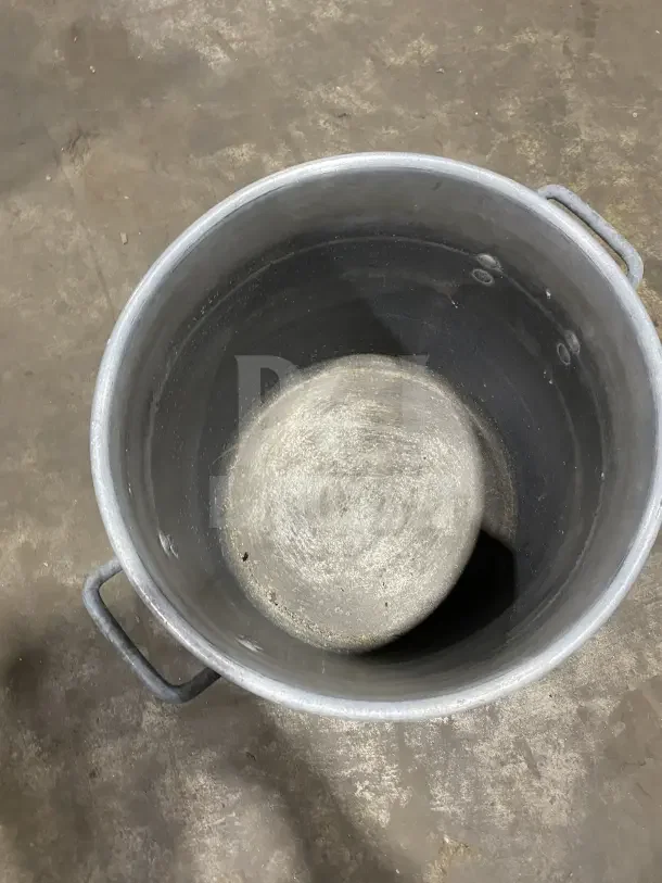 Commercial heavy-duty aluminum stock pot, large size, with sturdy handles. Used condition with visible wear. Ideal for mixing.