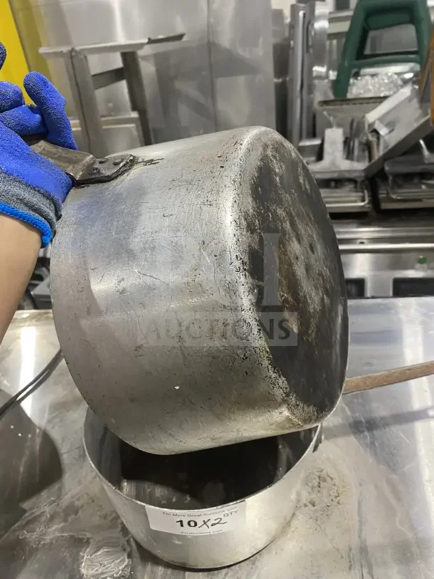 L&G commercial aluminum tapered sauce pans with heavy-duty handles, showing wear. Label: "10X2 QTY Pciauctions.com".
