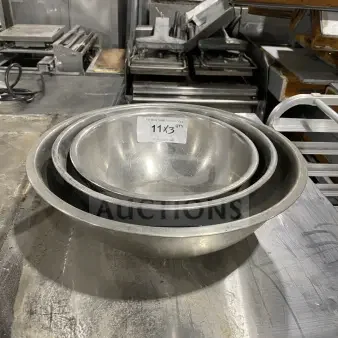 Three commercial stainless steel mixing bowls in varying sizes, in good condition. Auction label indicates lot "11x3" quantity.