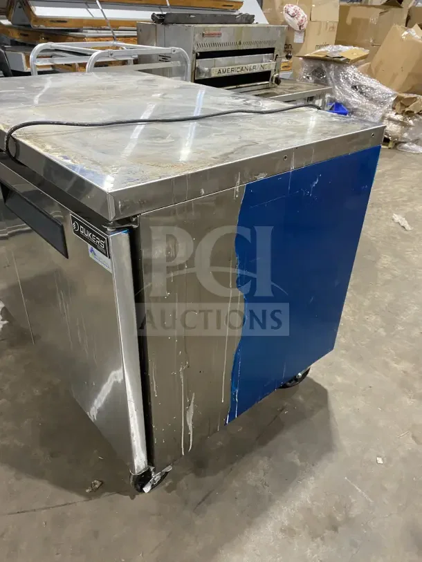 Dukers DUC48F commercial 2-door refrigerated worktop freezer, stainless steel, poly coated rack, on casters, model DUC48F.