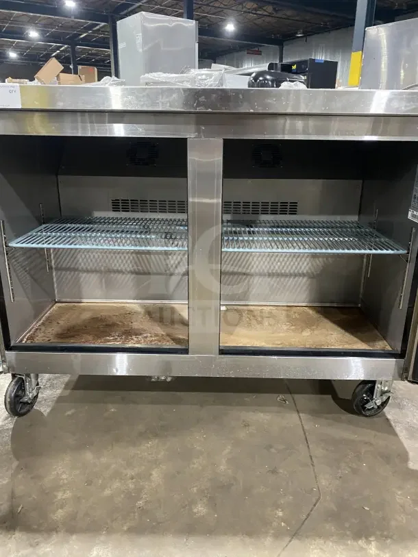 Dukers DUC48F stainless steel 2-door refrigerated lowboy/worktop freezer with poly-coated rack, on casters, 115V, 1 phase.