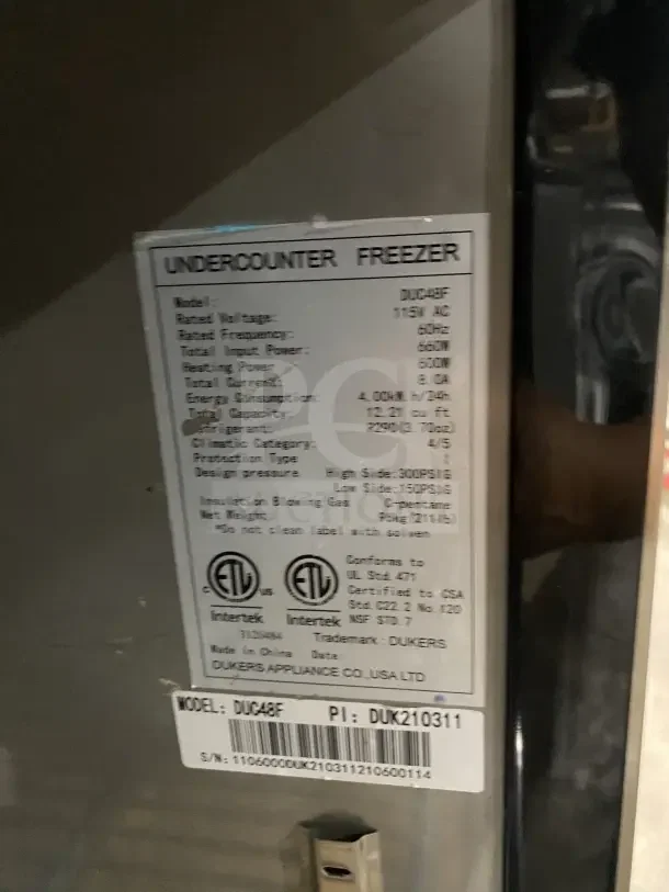 Dukers commercial 2-door refrigerated lowboy/worktop freezer, model DUC48F, stainless steel, poly-coated rack, on casters.