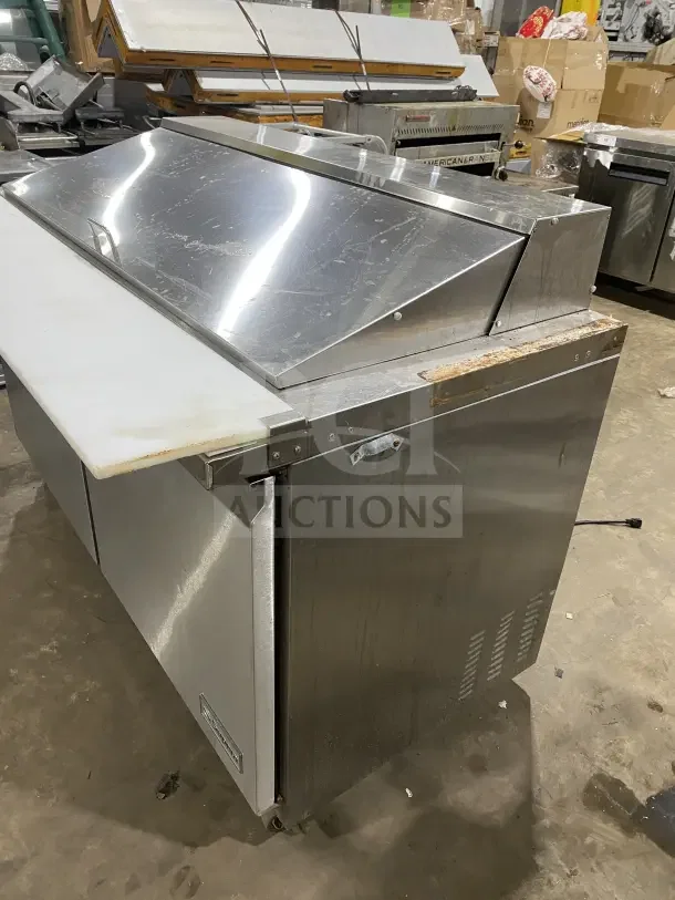 Supera PS61MTHC 2-Door Stainless Steel Refrigerated Pizza Prep Table on casters, with visible shelf, used condition.