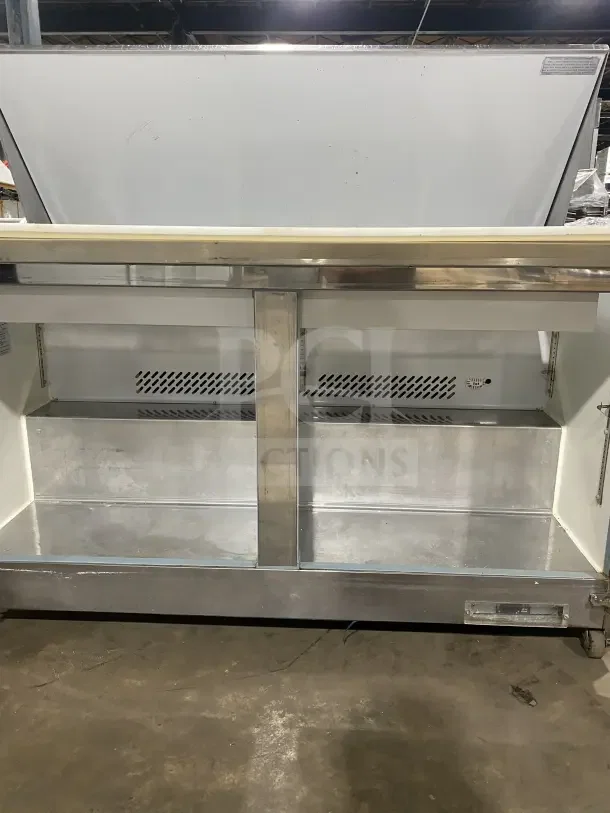 Supera PS61MTHC stainless steel 2-door pizza prep table, with 115V 1Phase, on casters, open lids, SN: 1903SUPQ1879.