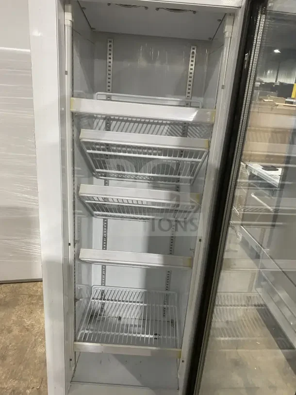 Commercial black gelato-style freezer with single glass swing door, door heater, LED light, poly-coated wire racks, model SD240.